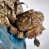 Patinated bronze holy water font