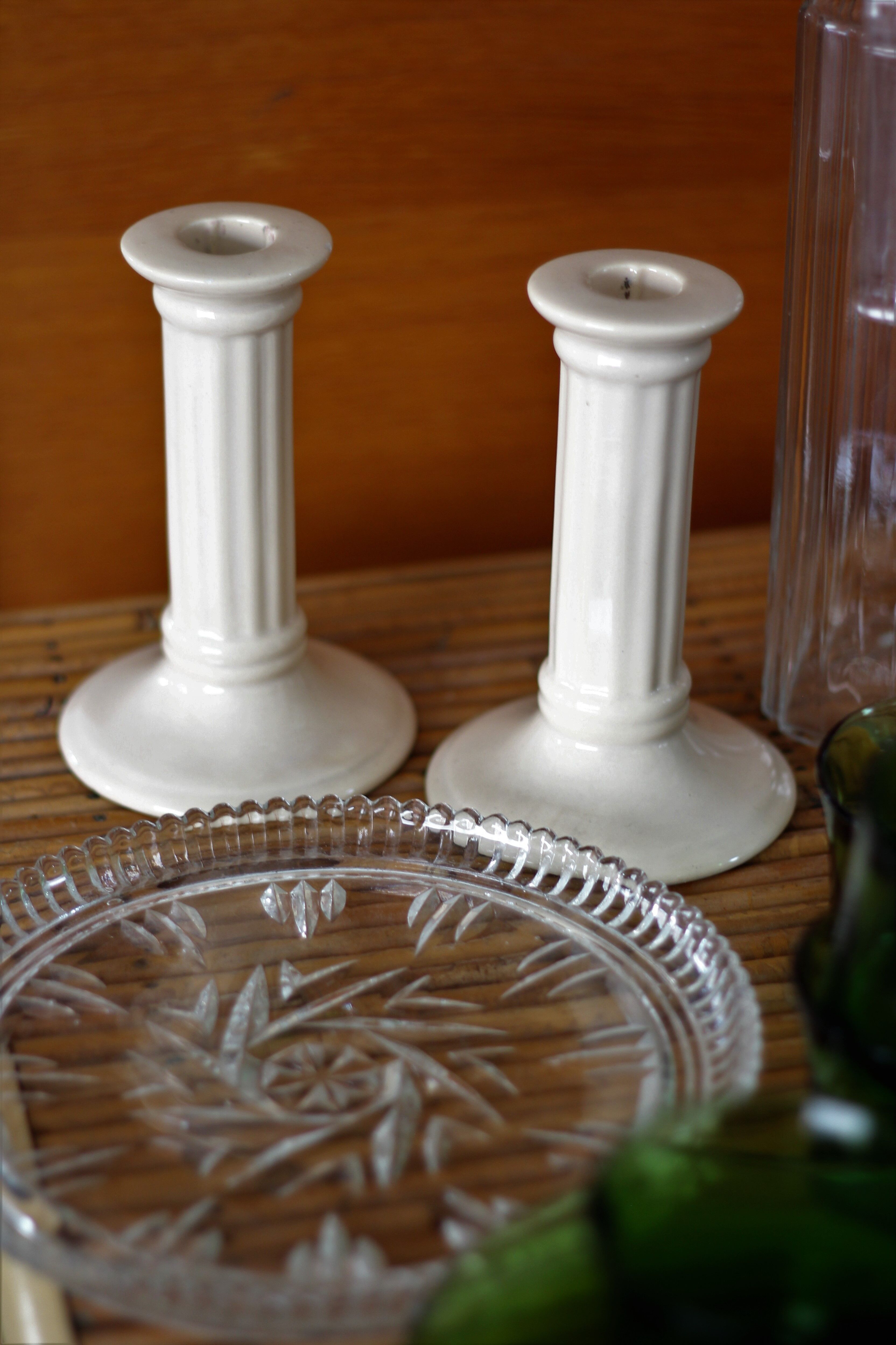 Pair of cream ceramic candlesticks