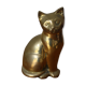 Cat sitting in brass