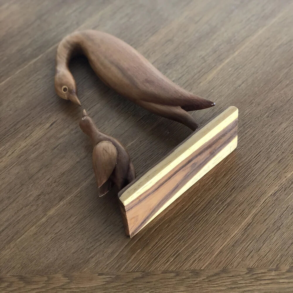 Sculpture of a goose feeding its young