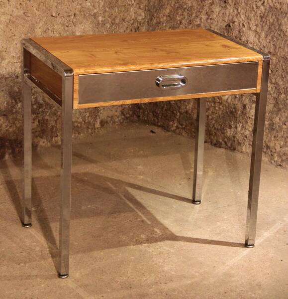 Small dressing table with chrome legs and oak laminate.