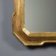 Antique cabaret mirror in gilded wood, Italy, mid-19th century.