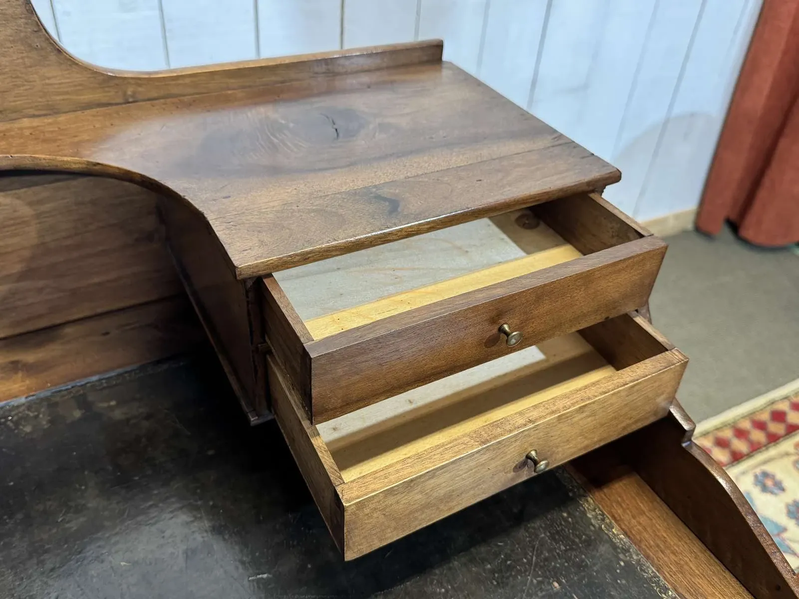 Louis XVI style desk from the late 19th century in walnut with a leather top.