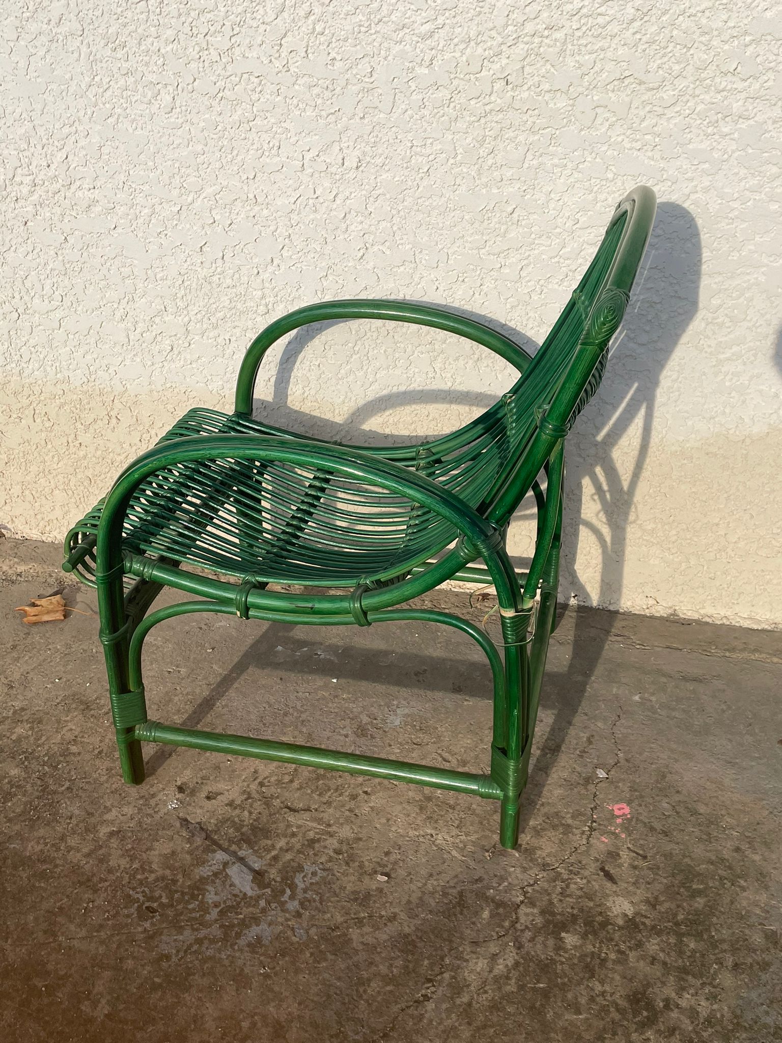 Green rattan armchair