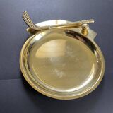 Round brass pocket tray with club and golf ball decoration.