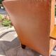 Low armchair, brown imitation leather