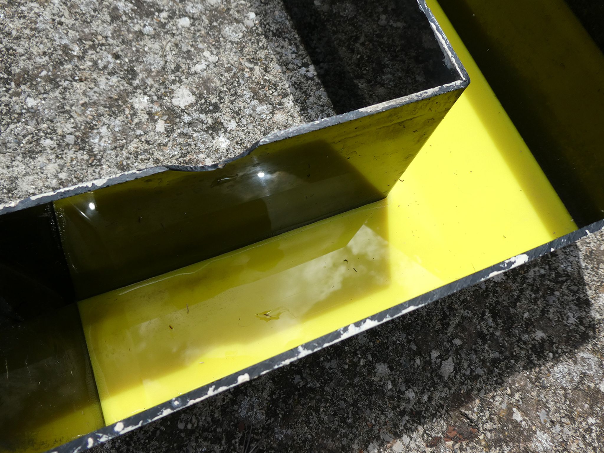 Letter "l" of industrial sign yellow and black