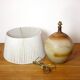 Large stone lamp with a cotton shade.