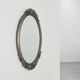 French Art Deco Oval Mirror with Carved Roses and Silver-Painted Frame