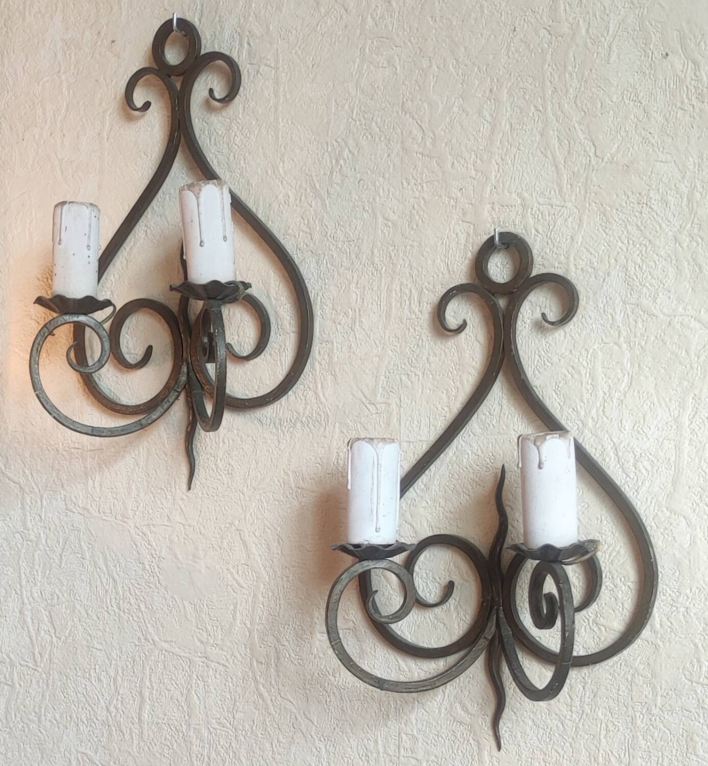 Old pair of wrought iron wall lights