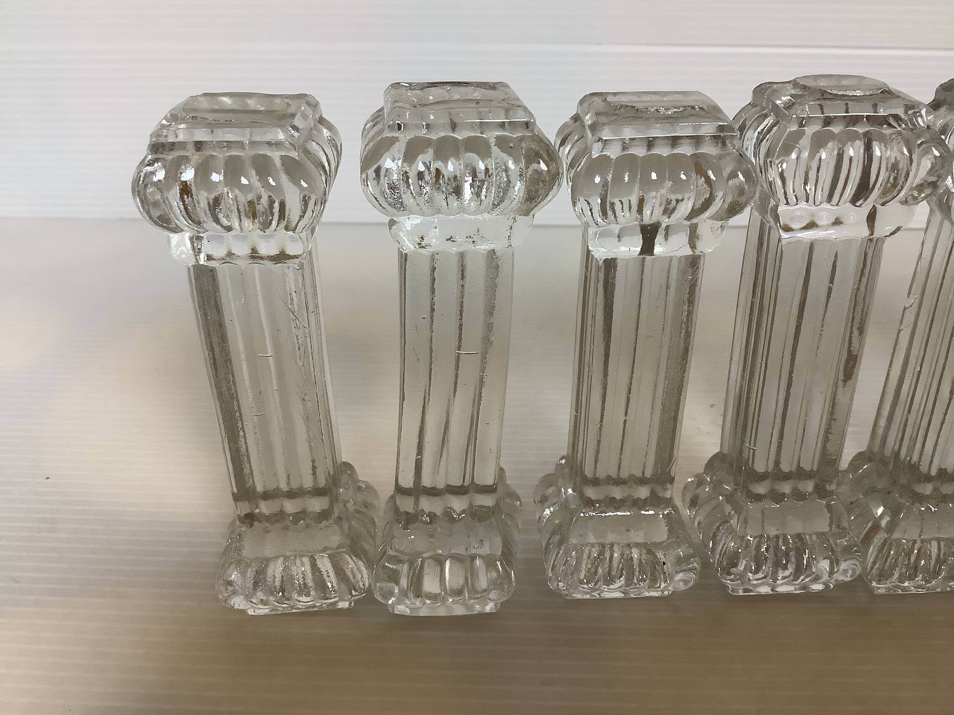 Ten old molded glass knife holders