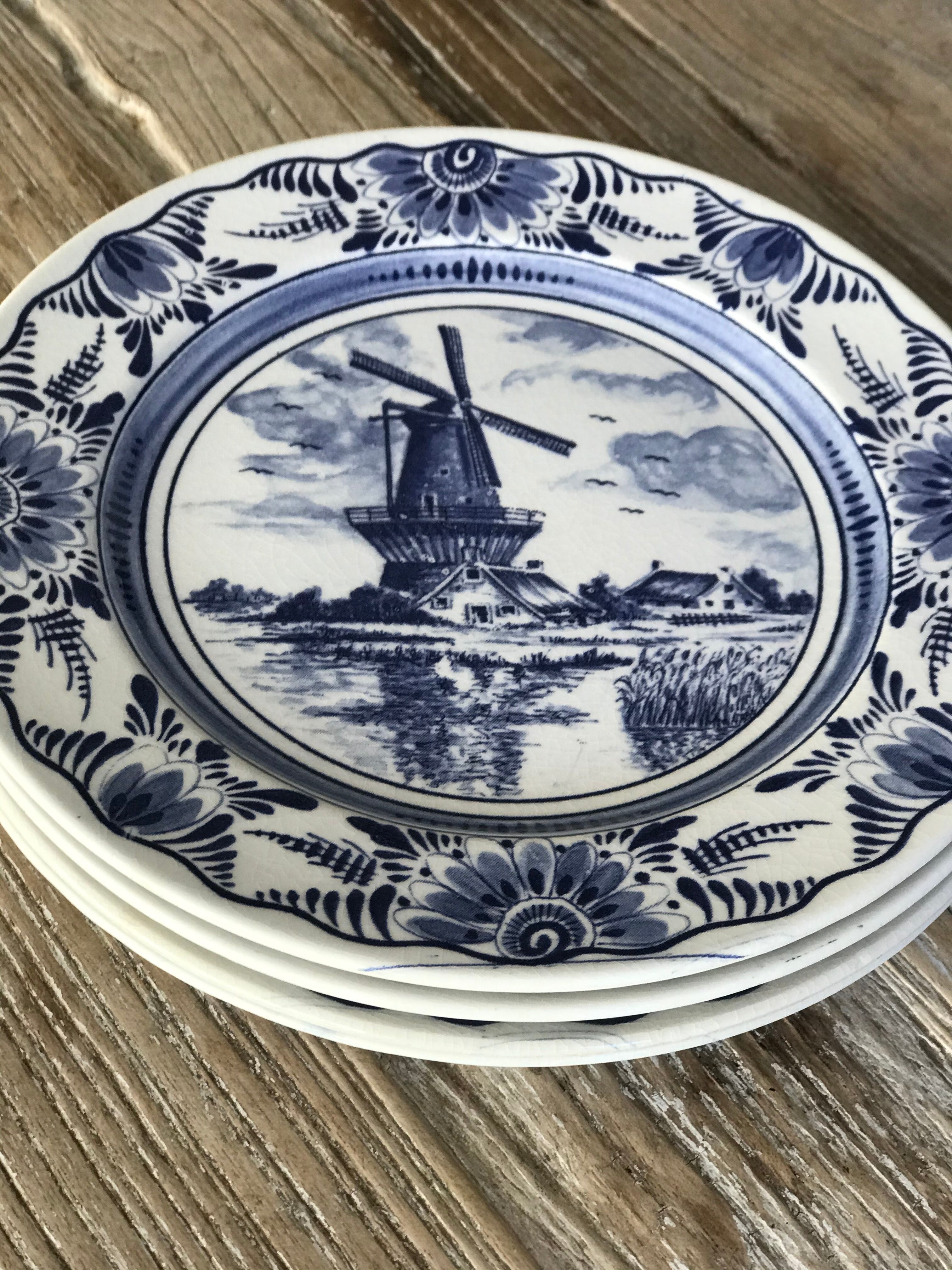 Lot of 4 dessert plates in white porcelain and Dutch mill design