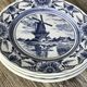 Lot of 4 dessert plates in white porcelain and Dutch mill design