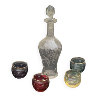 Liqueur carafe, or aperitif, carved with floral decoration in transparent glass and 3 polka dot glasses