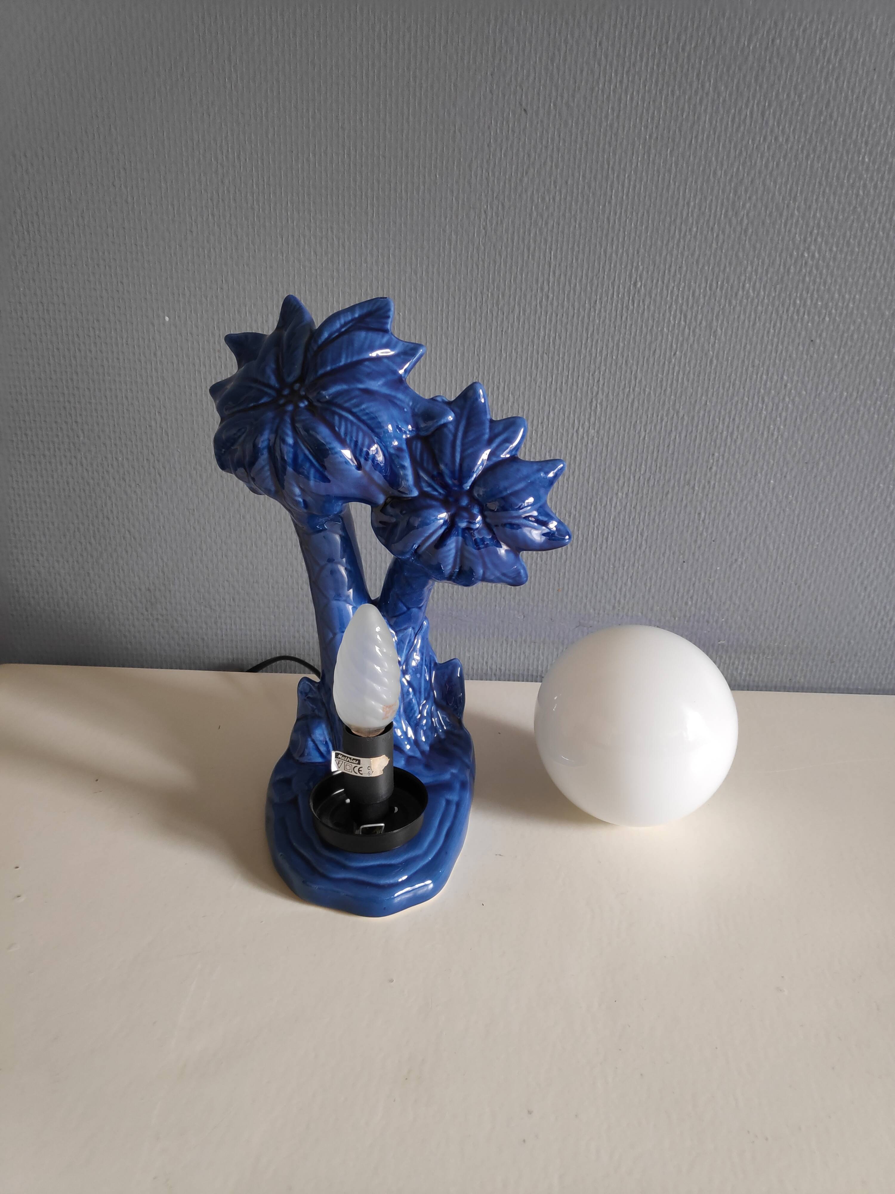Blue ceramic palm lamp and white opaline globe