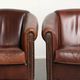 Set of 2 sheepskin club armchairs in a dark cognac colour