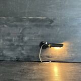 Old black metal and brass wall light, adjustable, 1930s.