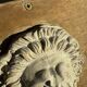 Lion's head in plaster by Walter De Buck