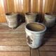 Set of 4 beige ceramic mugs fleur de lys vintage