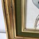 Table reproduction "beautiful colorful bird", gilded wood frame and green fabric