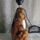 Carved wooden lamp with floral motif