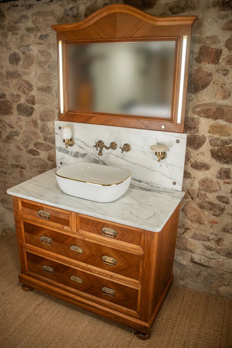 Antique washbasin cabinet from 1928 in wood and marble with a lighted mirror.
