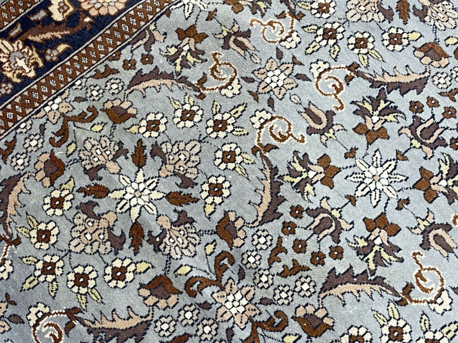 Handmade wool oriental carpet (wear defects)