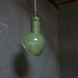 Old industrial enamel lamp in green
