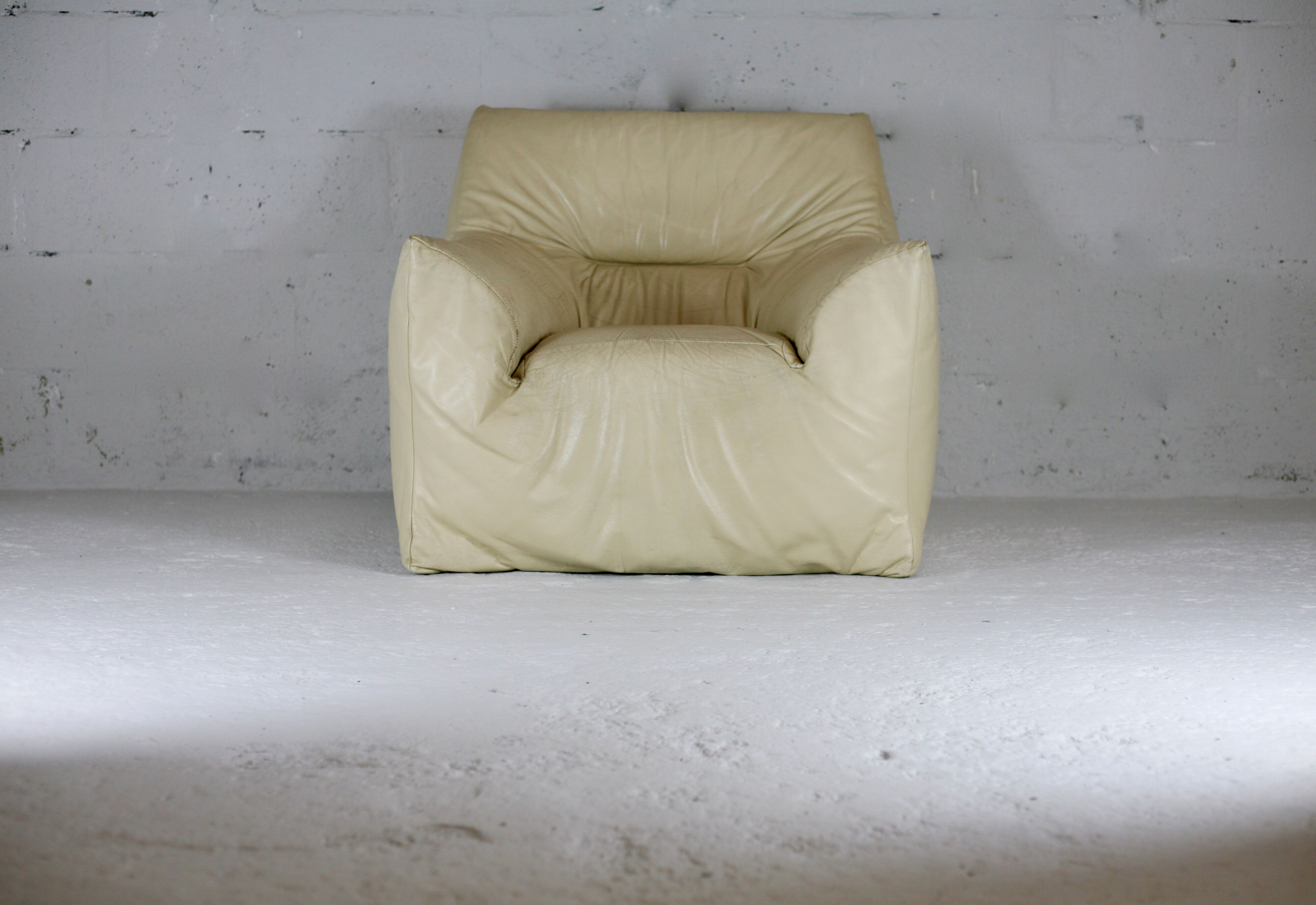 Leather armchair and cream-coloured foam, France , circa 1970