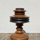 Foot of turned wooden lamp and carved