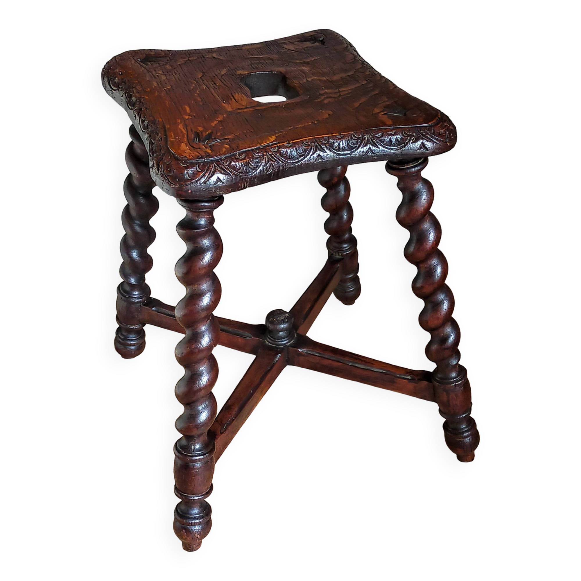 Antique stool in turned and carved solid wood