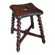 Antique stool in turned and carved solid wood