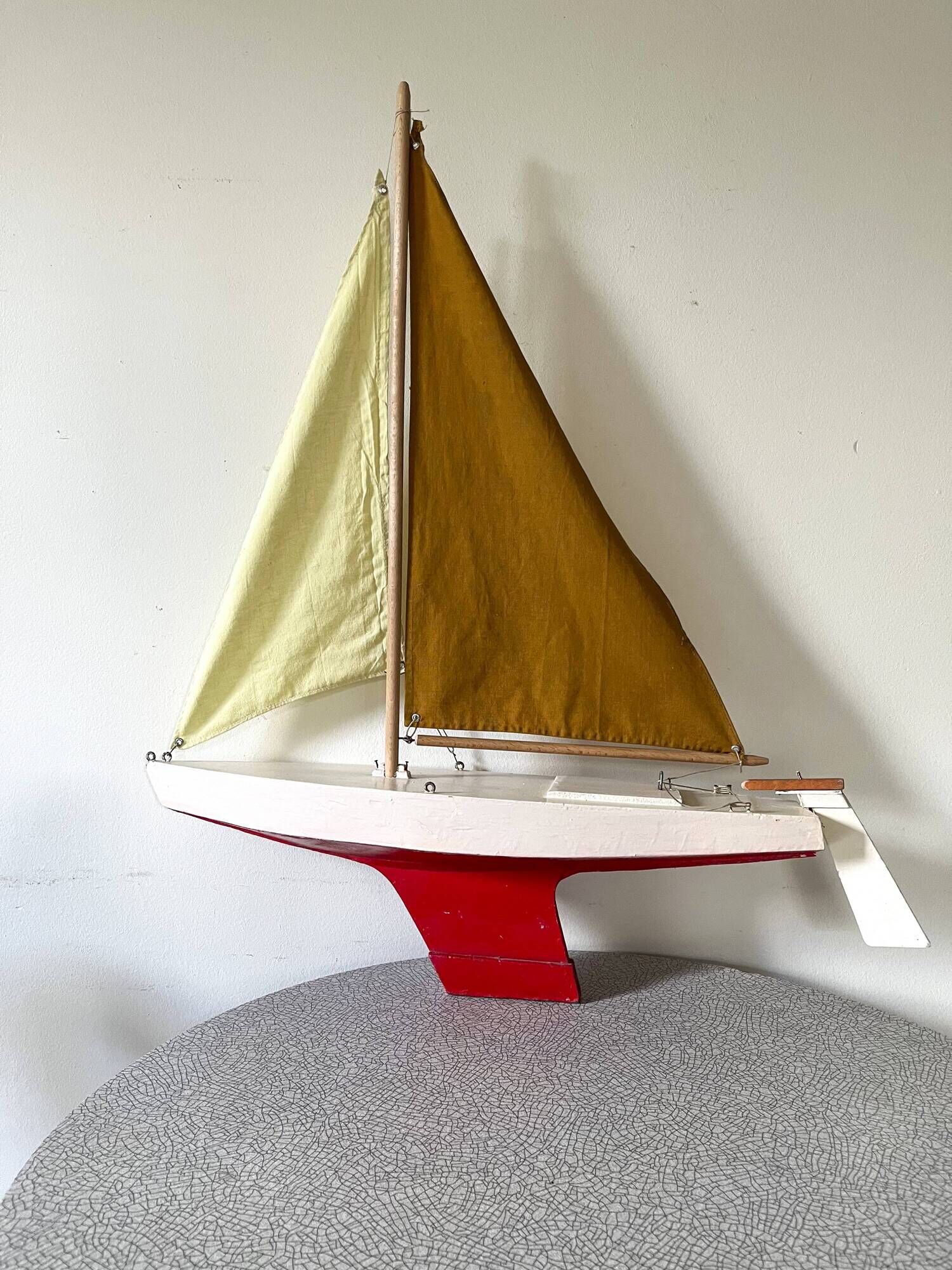 Navigable wooden sailing ship with pretty vintage colors