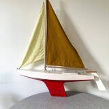 Navigable wooden sailing ship with pretty vintage colors