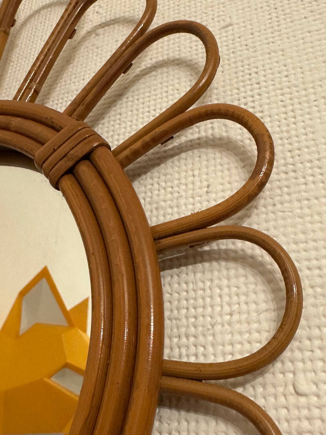 Old vintage asymmetrical round rattan mirror