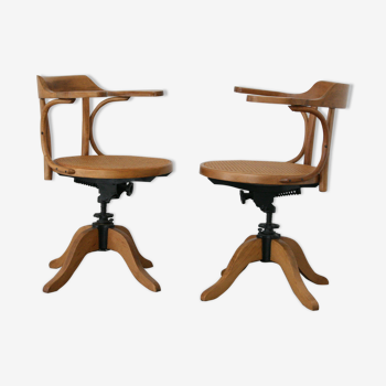 A pair of vintage bent wood svivel chairs by Salvaatore Leone Italy