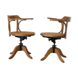 A pair of vintage bent wood svivel chairs by Salvaatore Leone Italy