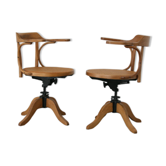 A pair of vintage bent wood svivel chairs by Salvaatore Leone Italy