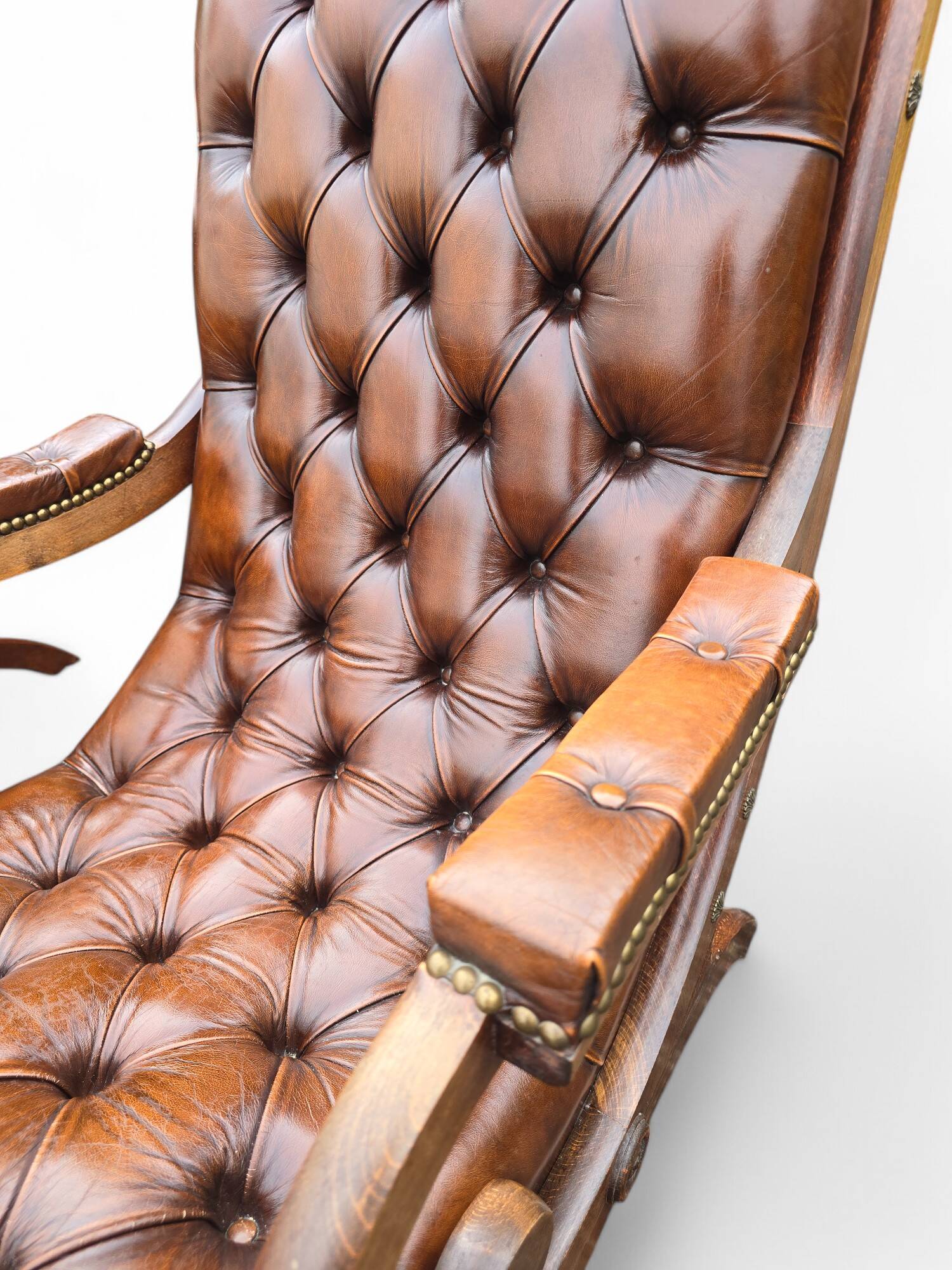 Pair of leather Chesterfields and footstools