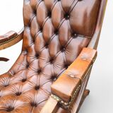 Pair of leather Chesterfields and footstools