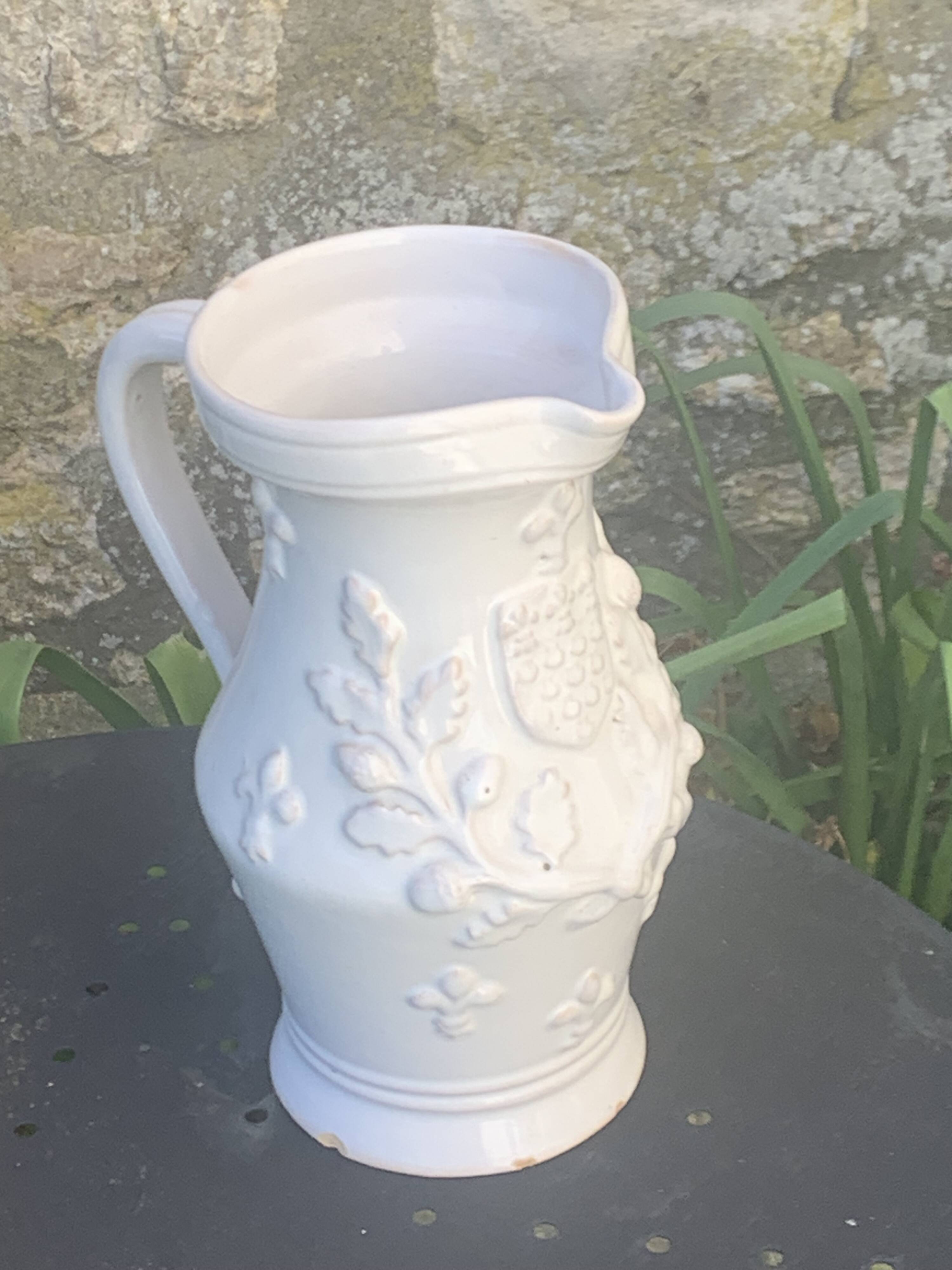 Carafe, pitcher signed Émile Tessier, Old France, in slip, ceramic