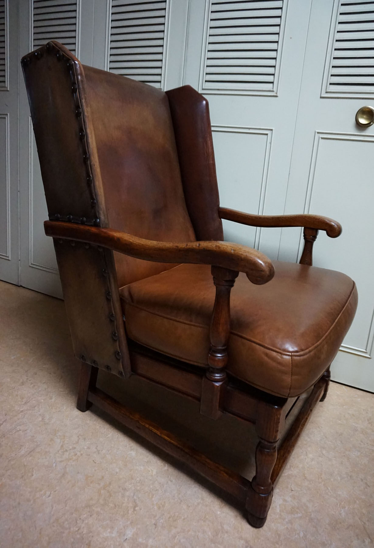English high back cognac leather wingchair by Criterion cord