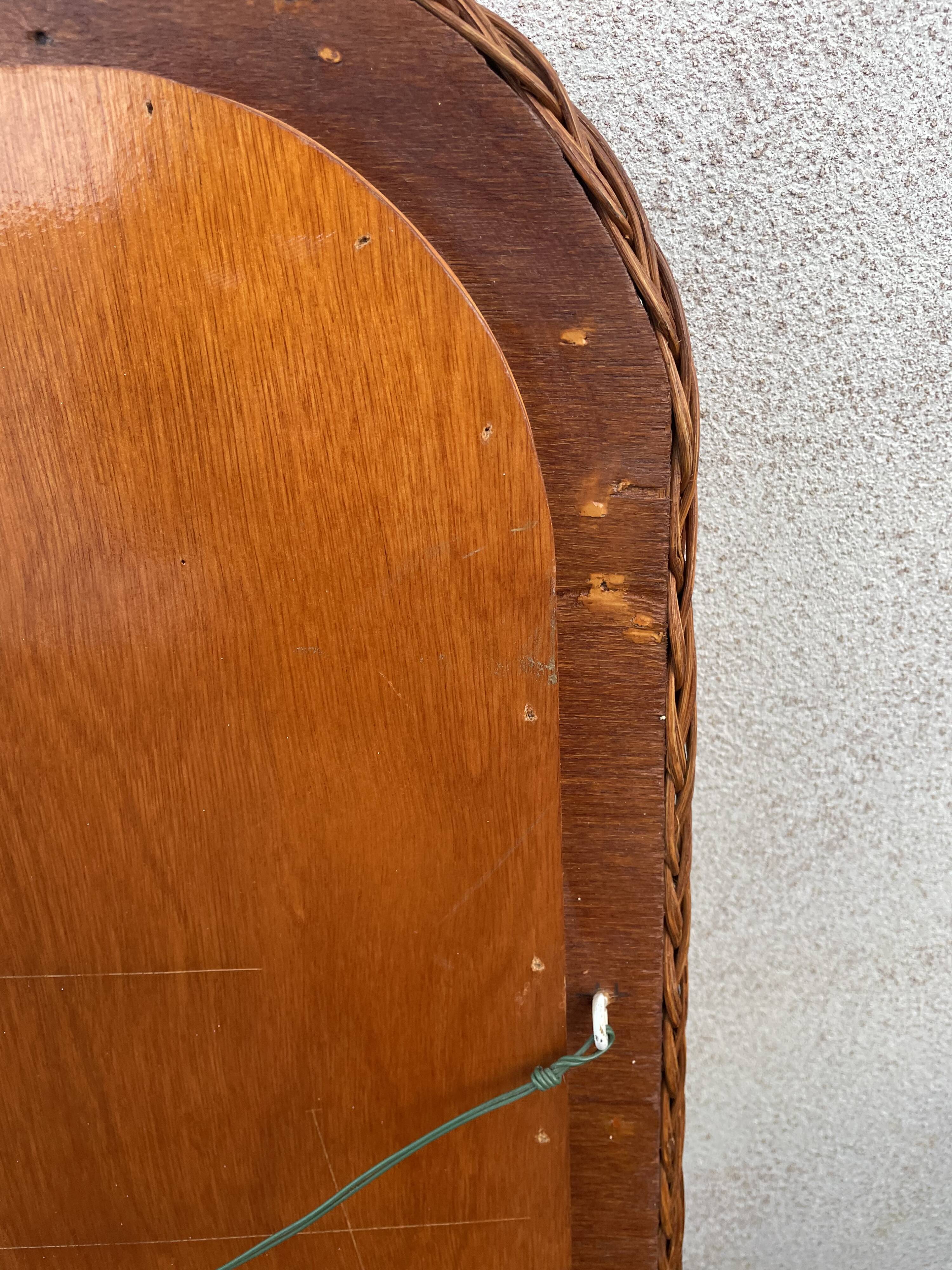 Curved rattan mirror 70s