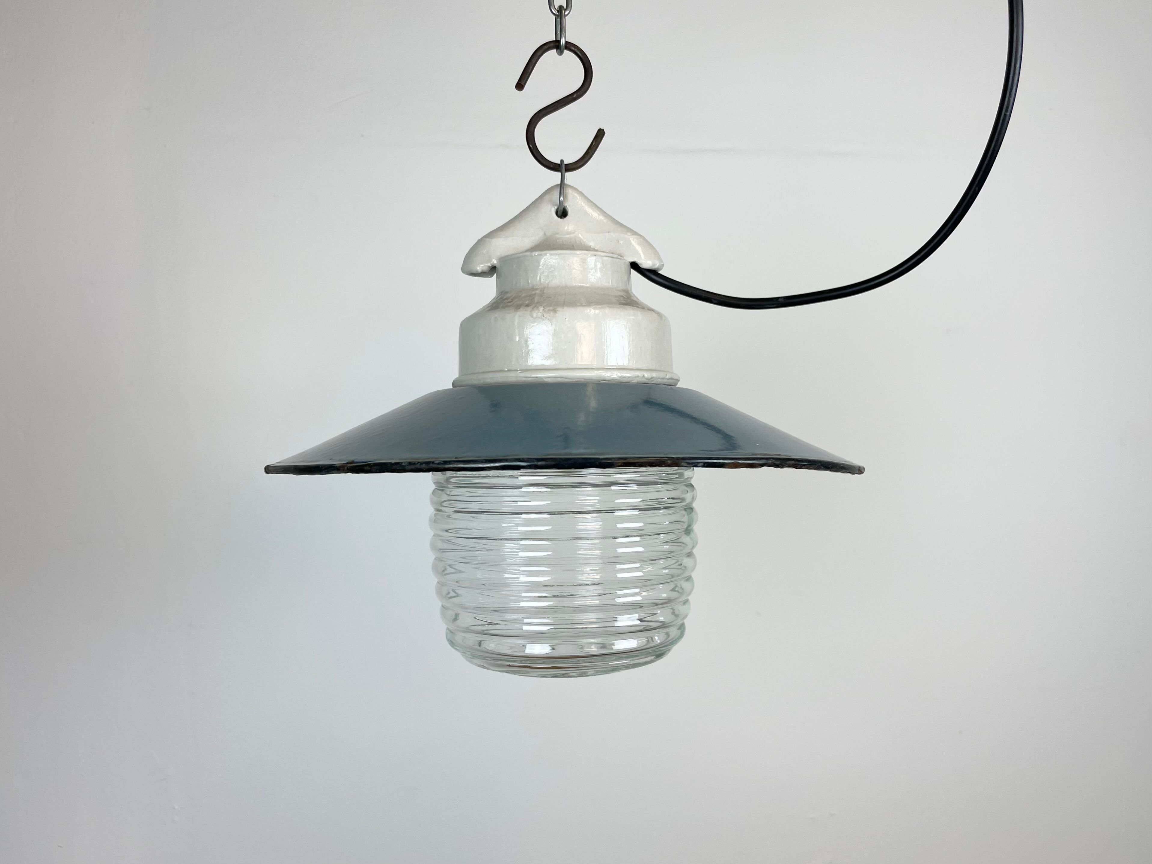 Industrial porcelain blue enamel pendant light with ribbed clear glass, 1970s