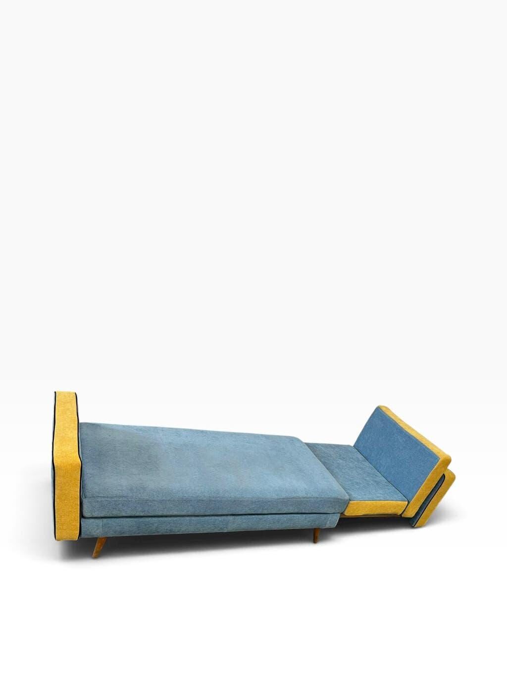 Vintage blue armchair/daybed/sofa bed with yellow accents.