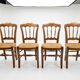 4 rustic farmhouse chairs made of wood and straw