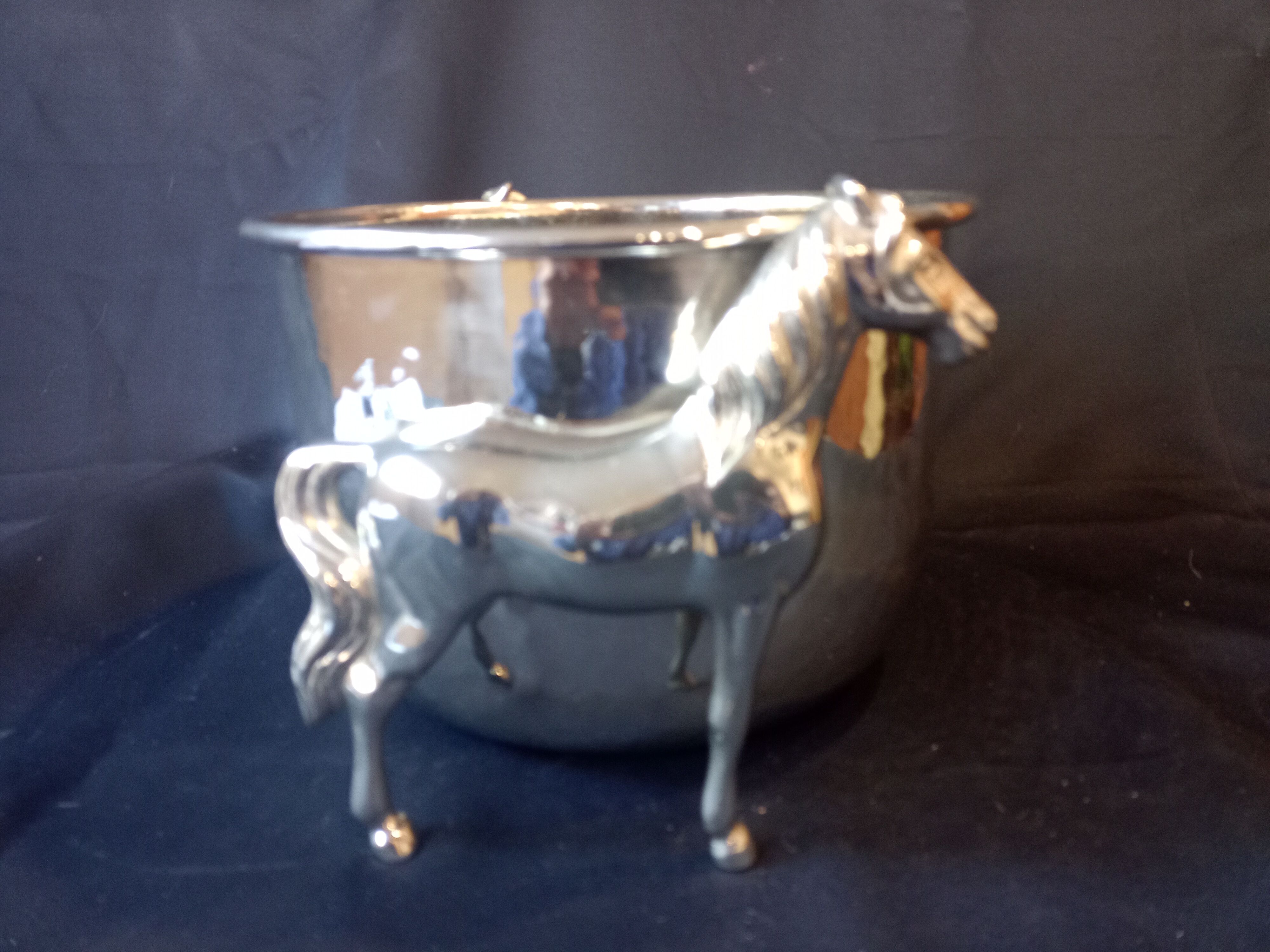 Bucket with decoration of horses