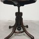 Antique curved wooden piano stool with kilim fabric from the 1910s.