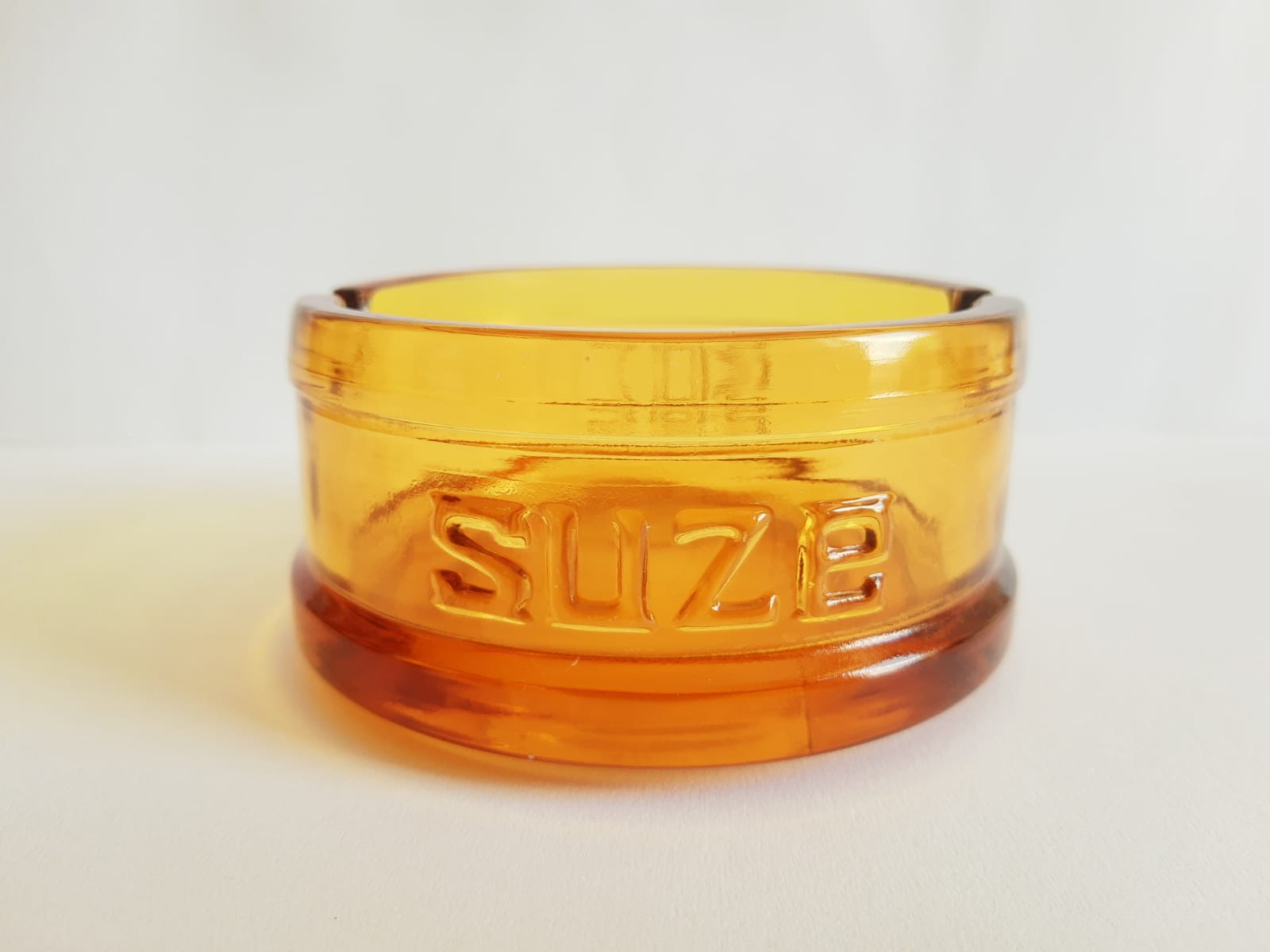 Advertising ashtray Suze amber glass