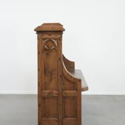 Antique oak church bench in Gothic style with beautiful wood carving